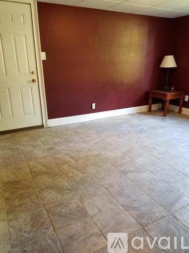 A room with a brown wall and a white door.