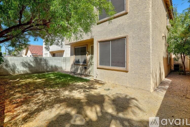 A house with a tree in front of it.