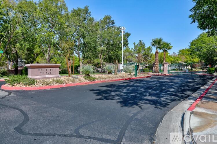 A street with a sign that says "Pacific Trace" on it.