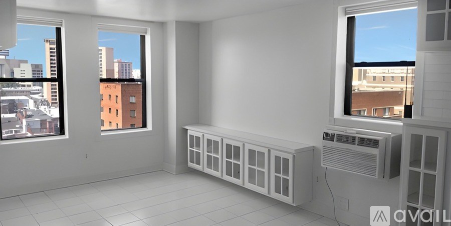 A city street with cars and traffic lights.