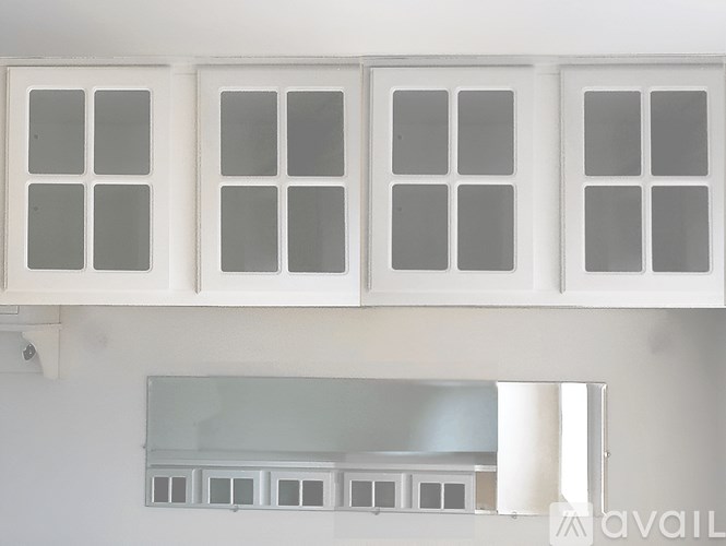 A living room with a fireplace and a chandelier.