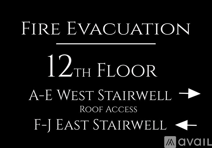 A sign indicating the fire evacuation route to the west stairwell.