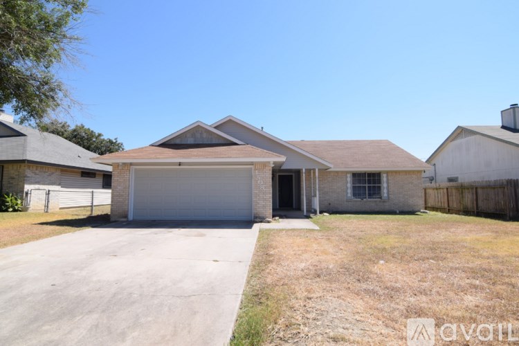 A house with a garage is available for rent.