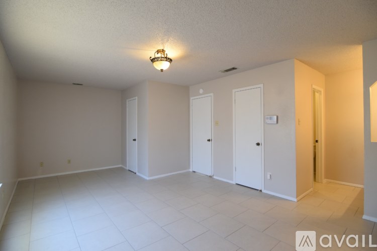 A room with white walls and a ceiling light.