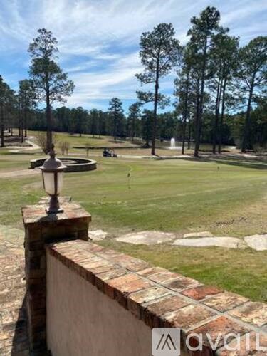 A view of a golf course from a balcony.