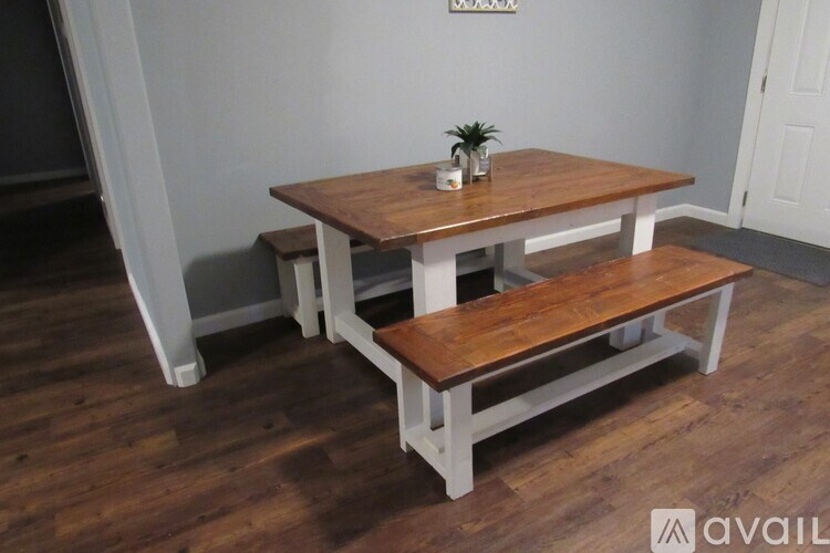 A wooden table with a bench underneath it.