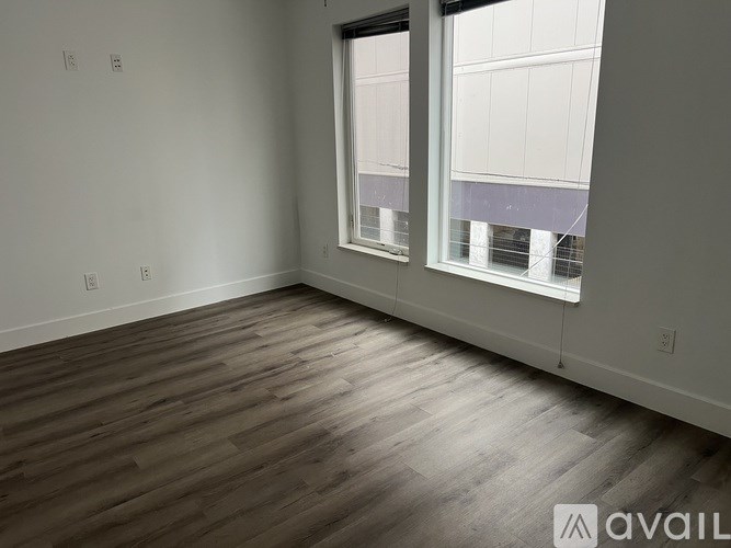 A bathroom with a toilet, sink, and shower.