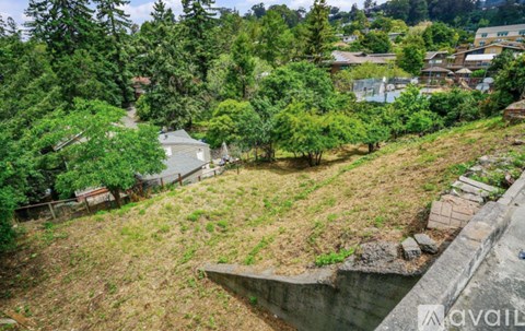 A view of a residential area with houses and trees.