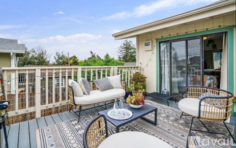 A patio with a table and chairs is shown.