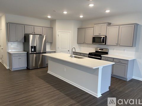 A modern kitchen with a large island in the middle.
