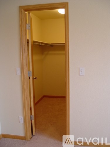 A room with a door open to another room.
