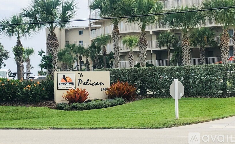 The sign in front of the building says The Pelican.