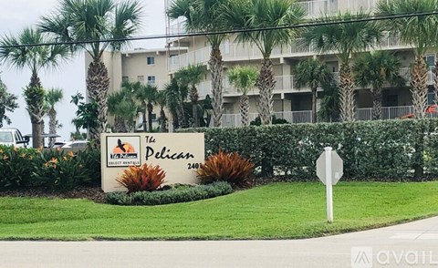 The sign in front of the building says The Pelican.