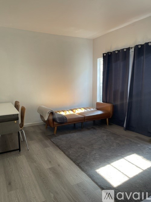 A room with a bed, a chair, and a bench.