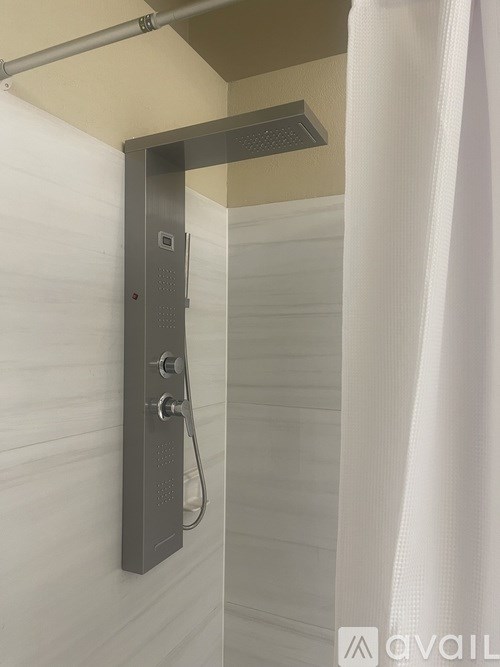 A shower head mounted on a wall.