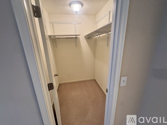 A small, empty room with a light on the ceiling.