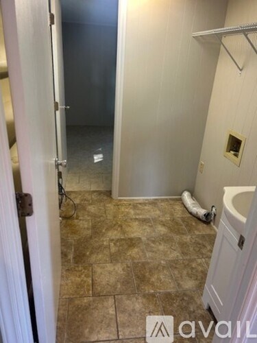 A bathroom with a toilet and a walk-in shower.