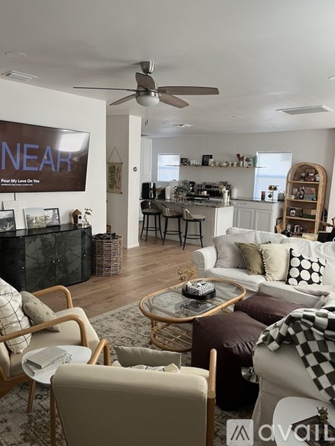 A living room with a black and white checkered chair and a coffee table.