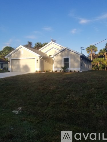 A house with a garage is for sale.