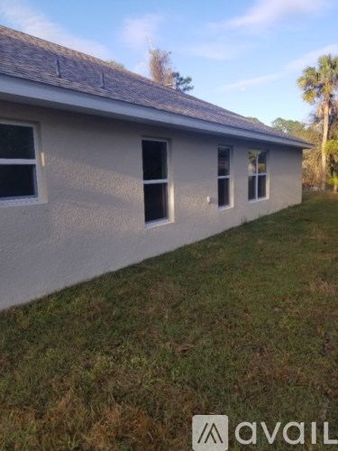 A house with a grassy lawn in front.