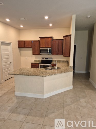A kitchen with a countertop and cabinets.