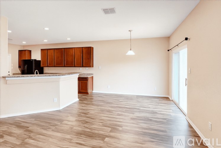 A kitchen with wooden cabinets and a white countertop.