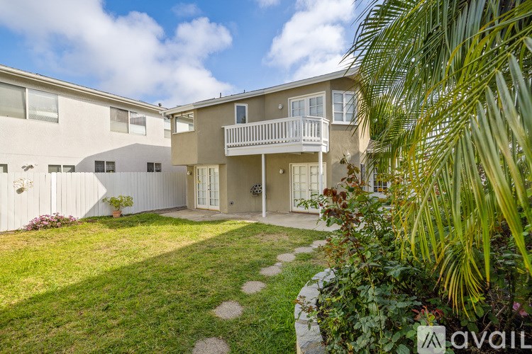 A sunny day at a well-kept apartment complex.