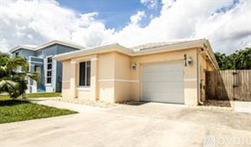 A two-story house with a garage is for sale.