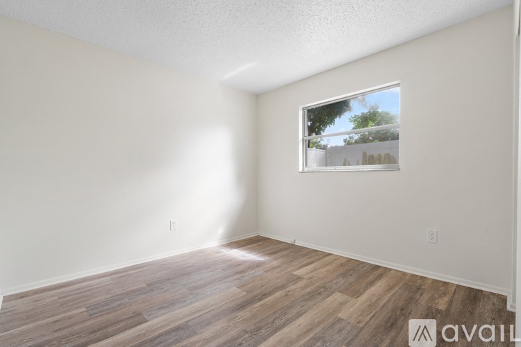 Empty room with tiled floor and a window.