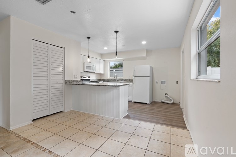 A bathroom with a sink, toilet, and bathtub.