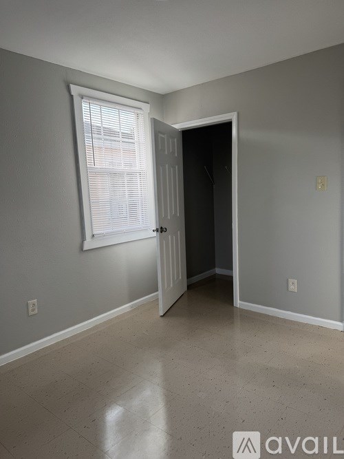 A room with a door and a window.