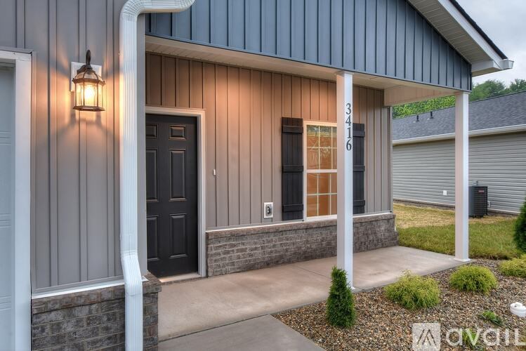 A house with the number 3416 on the front door.