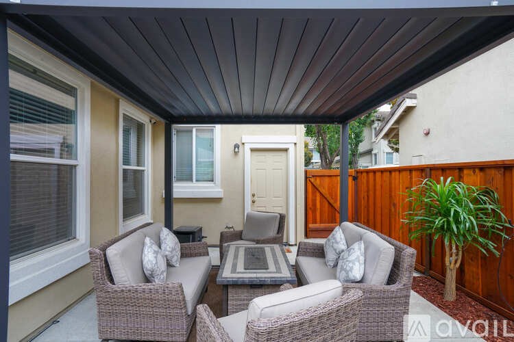 A patio with a table and chairs is available for rent.