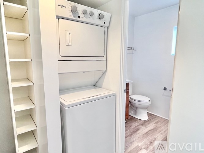 A white oven and dishwasher in a small kitchen.