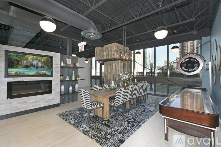 A living room with a piano and a fireplace.