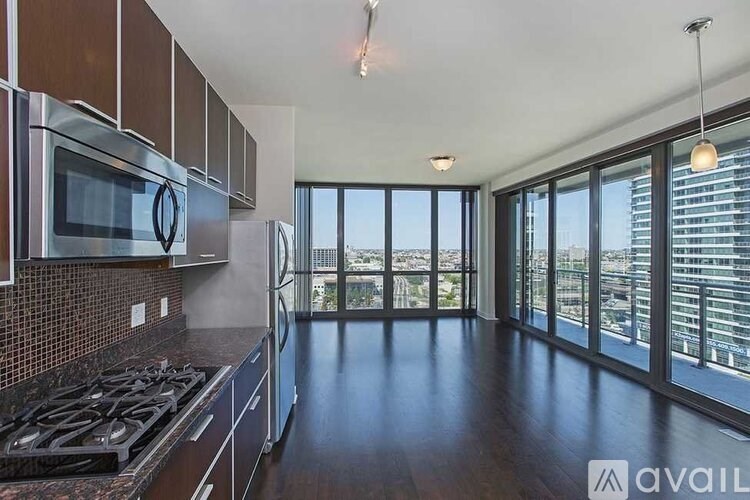 A kitchen with a stove top oven and a microwave.