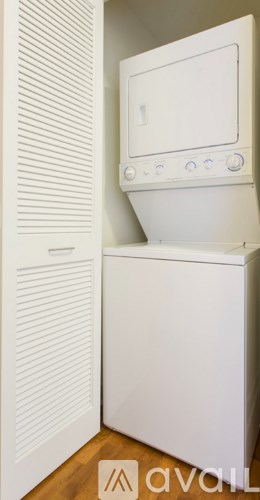A white microwave oven with a control panel on the front.