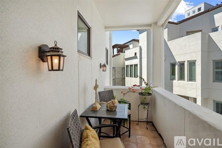 A patio with a table and chairs is shown.