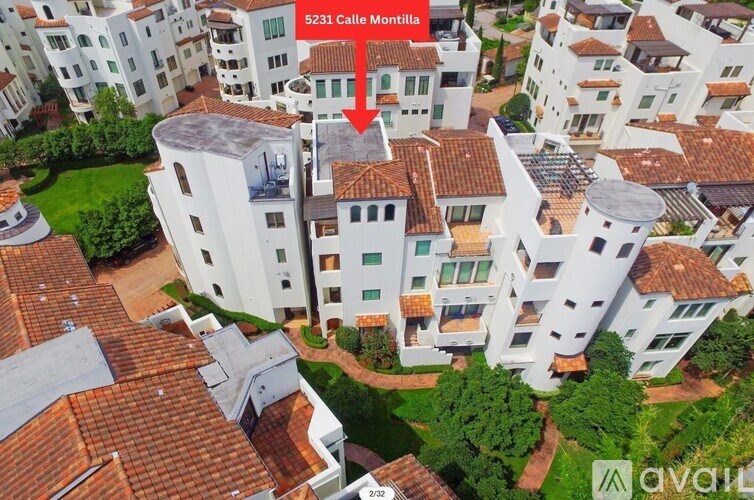 A red arrow points to a white building with the number 5231 on it.