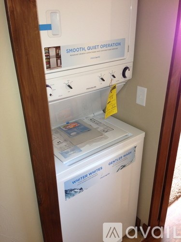 A washing machine with a tag on it that says Whiter Whites.