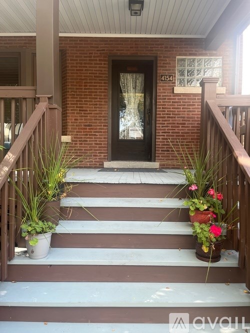A house numbered 4154 is shown with a front door and steps leading to it.