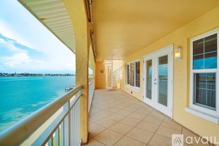 A balcony with a view of the sea.