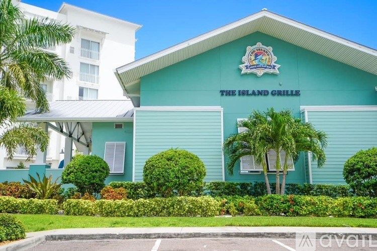 A blue building with a sign that says "The Island Grille".