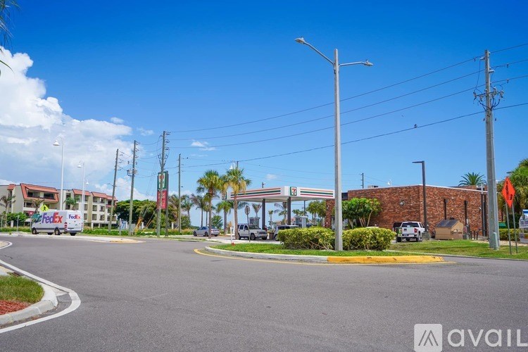 A street view with a FedEx truck and a building with a brick facade.