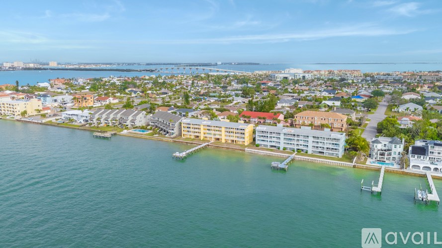 A bird's eye view of a coastal town with buildings and boats.
