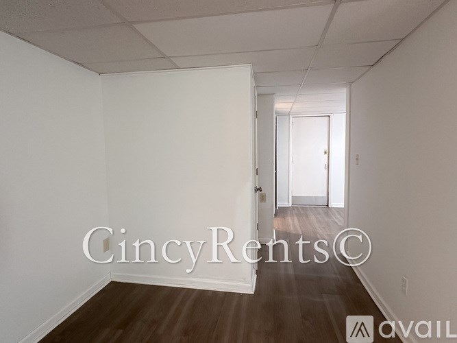 A long hallway with a door at the end.