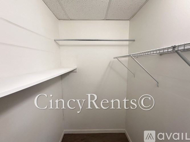 A white empty room with shelves and a logo that says CincyRents.