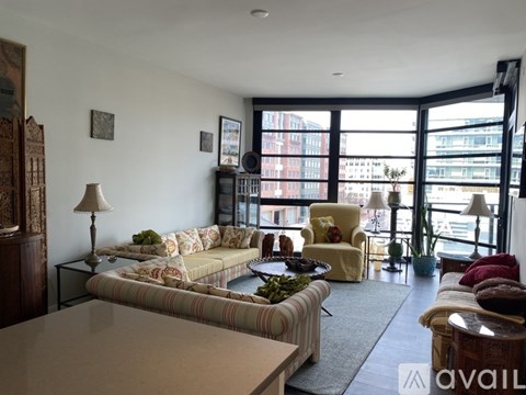A living room with a striped couch and a coffee table.