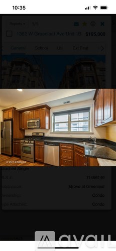A kitchen with wooden cabinets and a window.