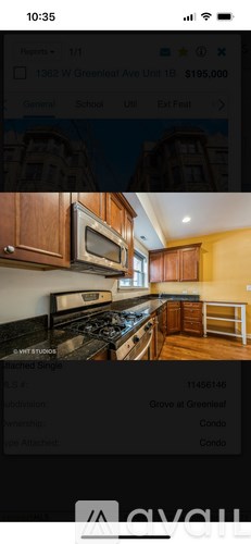 A kitchen with wooden cabinets and a stove top oven.